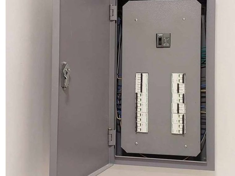 Replacement panelboard flush-mounted with breakers arranged in order