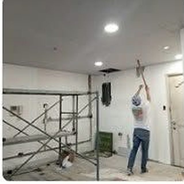 Mustasa crew working from scaffolding on a ceiling during a fit-out